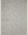 The Andorra Rug - Albatross by Armadillo&Co is a rectangular, light gray, 100% wool area rug with a subtle speckled pattern for artisan quality and timeless style.