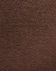 Close-up of a textured brown surface with small granules, evoking the vintage vibe found in Ethnicraft’s Barrow Lounge Chair - Copper.