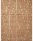The Loloi Bodhi Rug - Natural / Ivory Abstract is a hand-knotted rectangular rug made from 100% jute with a tan woven texture and irregular cream lines for a modern, abstract look.