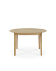 The Bok Round Extendable Dining Table in solid oak by Ethnicraft features four straight legs and is pictured from the front against a plain white background.