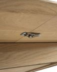 Close-up of a metal latch lock on light wood, showcasing the grain and craftsmanship of the Ethnicraft Bok Round Extendable Dining Table - Oak.