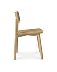 Side view of the Ethnicraft Casale Dining Chair - Oak, featuring a flat seat, slightly reclined backrest, and straight legs in European oak. Its simple modern design reflects classic refinement and is shown against a plain white background.