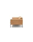 The Department Sofa | Leather by Wooden Stories is a tan, modern sofa seen from the side against a white background, highlighting its armrest, backrest, slim black legs, and FSC-certified oak solid wood base.