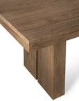 Close-up of the Ethnicraft Double Extendable Dining Table in natural teak, showcasing a thick rectangular tabletop and wide block-style legs with a natural wood grain finish against a white background.