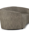 The Ellipse Sofa - Ash by Ethnicraft features a low, rounded back and smooth, seamless design, upholstered in textured gray fabric and shown from an angled rear view.
