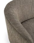 Close-up of the Ellipse Sofa - Ash by Ethnicraft, showcasing its modern design with gray textured upholstery and a curved backrest and seat cushion, inspired by Jacques Deneef, set against a white background.