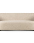 The Ellipse Sofa - Oatmeal by Ethnicraft is a modern piece with a curved backrest, rounded armrests, and light beige upholstery on subtle black feet, featuring a smooth and minimalist design.