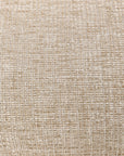 Close-up of the Ellipse Sofa - Oatmeal by Ethnicraft, showing its beige woven fabric with a textured grid pattern and interlaced neutral-toned threads.