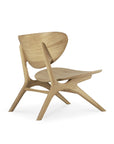The Ethnicraft Eye Lounge Chair - Oak showcases a modern curved backrest and seat, angled legs, and minimalist lines, crafted from premium European oak and displayed on a white background.