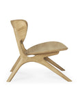 Side view of the Ethnicraft Eye Lounge Chair - Oak, showcasing smooth, curved lines and an organic sculptural form, crafted from European oak and displayed against a plain white background.