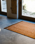 The Radhi Rug - Umber by HIMALAYAN HERMITAGE is a handwoven wool rug that brings warmth and texture to your space.