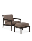 A modern Ethnicraft Jack Lounge Chair with a dark wood frame and taupe cushions, paired with the matching Jack Footstool in nubuck leather—both featuring clean lines and Scandinavian modern inspiration.