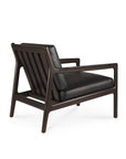 The Ethnicraft Jack Lounge Chair - Black Leather, inspired by Scandinavian modernism, features a dark wooden frame, angled back, wide armrests, and black leather cushions, shown from the rear against a white background.