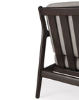 Close-up of the back corner of an Ethnicraft Jack Lounge Chair - Ivory, highlighting its Scandinavian modernist design with a dark brown wooden frame and ivory upholstered cushion, set against a plain white background.