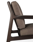 Side view of Ethnicrafts Jack Lounge Chair in nubuck leather, featuring a dark mahogany frame, thick taupe-colored cushioned seat and backrest, and clean lines for a minimalist mid-century modern look.