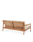 The Ethnicraft Jack Outdoor 2 Seater Sofa is shown from the back, featuring a wooden frame in Grade A teak, natural light beige cushions, and modern slatted design set against a white background.