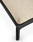 Close-up of the Ethnicraft Jack Outdoor Footstool—Black Teak with Natural—showcasing its light beige upholstered seat and dark FSC-certified teak frame against a white background.