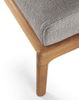 Close-up of the Ethnicraft Jack Outdoor Footstool, featuring a Grade A teak leg in a light brown finish and a textured mocha upholstered cushion, with the seat corner and leg shown against a white background.