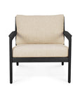 The Ethnicraft Jack Outdoor Lounge Chair features a black teak frame and natural outdoor-grade cushions, shown from the front against a white background.