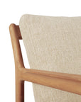 Close-up of Ethnicrafts Jack Outdoor Lounge Chair – Teak with Natural, showing its Grade A teak frame and textured light beige upholstered backrest that highlights the natural wood grain and woven fabric details.