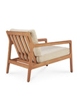 The Jack Outdoor Lounge Chair - Teak with Natural by Ethnicraft is a mid-century modern piece made from Grade A teak, featuring light beige cushions and an angled slatted backrest, displayed on a white background.