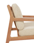 A close-up of the Ethnicraft Jack Outdoor Lounge Chair – Teak with Natural shows its light beige, textured cushions and minimalist Grade A teak frame, offering a modern, mid-century look perfect for any outdoor lounge.