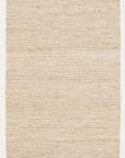 The Kalahari Rug - Natural / Chalk by Armadillo&Co is a rectangular, handwoven jute rug in beige tones with a subtle wavy texture and darker edges against a plain background.