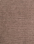 Close-up of SOBU’s Material Swatches, featuring a brown textured carpet sample from the Danish Collection. The surface displays visible horizontal lines and a soft, slightly rough texture. A small white diamond-shaped tag in the bottom right corner highlights one of the high-quality materials available from the SOBU Material Swatches selection.