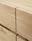 Close-up of the Ligna Sideboard by Ethnicraft, highlighting the smooth finish, seamless joinery, and attractive grain of its light European oak drawers and edges.