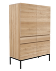 The Ethnicraft Ligna Storage Cupboard features four doors, sleek horizontal handles, and a modern design in European oak with a black metal base—a striking example of classic European refinement.