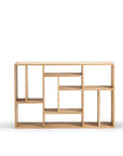 The Ethnicraft M Rack Short - Oak is a solid oak bookshelf with a natural finish, featuring an asymmetric Mondrian-inspired design of rectangular and square open shelves in a geometric pattern.