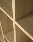 Close-up of the Ethnicraft M Rack Short - Oak, featuring solid oak construction with intersecting panels and distinctive wood grain, highlighting clean lines and a Mondrian-inspired minimalist design.
