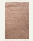 The Malawi Rug - Blush by Armadillo&Co is a rectangular, hand-knotted area rug in light brown with subtle horizontal lines and short fringe tassels on both ends, offering an artisanal touch against a plain background.