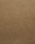 Close-up of light brown leather texture from Wooden Stories' Fabric + Leather Swatches, featuring fine natural grain and subtle creases—ideal for custom made-to-order pieces.