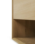 Close-up of the Ethnicraft Nordic Sideboard - 4 door, a modern furniture piece crafted in smooth European oak with clean lines and right angles, shown against a plain white background.