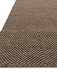 Close-up of the Oakwood Rug - Dune by Loloi, a brown wool rug with a handwoven textured geometric diamond pattern, shown at an angle to highlight its repeating design.