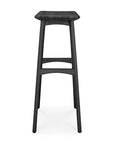 The Ethnicraft Osso Barstool - Black is a modern, three-legged solid oak stool with a square seat and no backrest, shown against a white background.