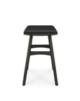 The Osso Dining Stool by Ethnicraft features a black-stained oak frame, modern rectangular design, leather seat, angled legs, and dual support bars—capturing European refinement—shown front-facing on a white background.