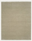 The Paragon Rug - Birch by Armadillo&Co is a square, beige Fair Trade artisan rug with a subtle textured pattern, hand-knotted from wool for an even tone and minimalistic design without borders or decorations.