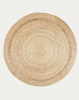 The Petunia Rug by Armadillo&Co is a round, woven 100% jute rug featuring natural beige and tan circular patterns, shown on a plain white background.