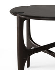 Close-up of the Ethnicraft PI Side Table - Mahogany, featuring smooth, rounded edges and sculptural curved legs, set against a white background—highlighting modern mahogany craftsmanship.
