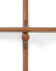 Close-up of the Ethnicraft PI Wall Shelf - Mahogany (2 shelves), showing four smooth, rounded mahogany rods intersecting in a cross shape against a white background.