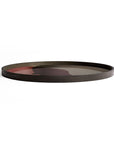 The Ethnicraft Pinot Combined Dots glass Tray - Round / Extra Large features a minimalist, abstract portrait in muted colors on its dark surface, displayed against a simple white background.