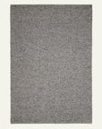 The Pompeii Rug - Ore by Armadillo&Co is a rectangular, textured gray rug with a subtle woven pattern, shown against a light background.