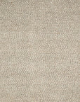 Close-up of the Loloi Quarry Rug - Oatmeal, a hand-knotted wool rug with tightly packed loops for a pebble-like texture, featuring neutral cream and light tan tones.