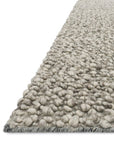 Close-up of the Quarry Rug - Stone by Loloi, featuring chunky, rounded 100% wool loop pile in light gray—showcased against a white background.
