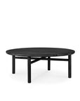 The Ethnicraft Quatro Outdoor Coffee Table features a round black teak top, four legs, and a crossbar support, shown against a white background.