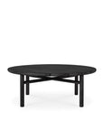 The Quatro Outdoor Coffee Table by Ethnicraft features a round, black teak slatted top and four cylindrical legs with crossbars, displayed against a white background.