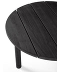 Close-up of the Ethnicraft Quatro Outdoor Side Table 23.5 in Black Teak, featuring a round tabletop with three visible slats and one leg, shown against a white background.