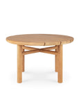 The Ethnicraft Quatro Outdoor Side Table 23.5 features a round Grade A teak top with four sturdy legs and angled crossbars, displaying a sleek, modern design and natural wood grain typical of the brands style.